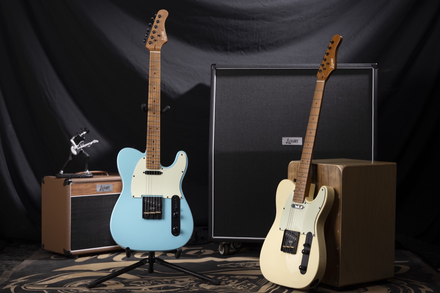 Fixed bridge electric guitars displayed with amplifiers